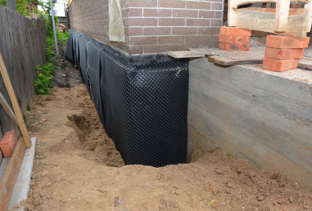 SJ Waterproofing Pros technician performing targeted Interior Drainage System assessment in Sycamore, AL